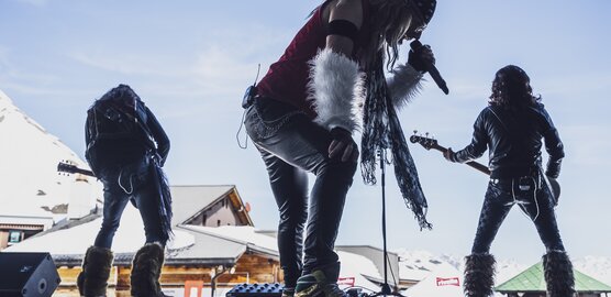 A cover band plays their concert during the Cover Festival Davos Klosters at the Parsennhütte