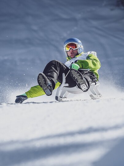 Schlittler beim Schlittelrennen auf dem Rinerhorn | © Marcel Giger
