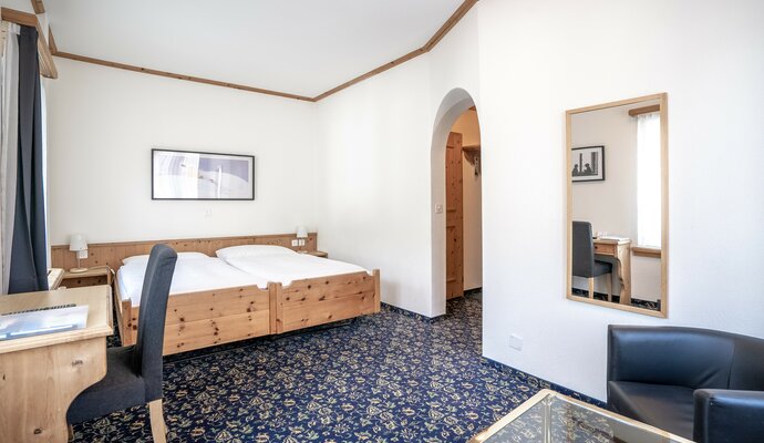 Zimmerstandard Doppelzimmer Economy einfach und schlicht. | © Davos Klosters Mountains