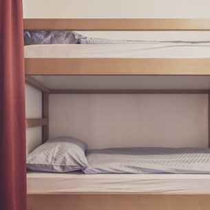 Bunk bed with bedding  | © Davos Klosters Mountains 